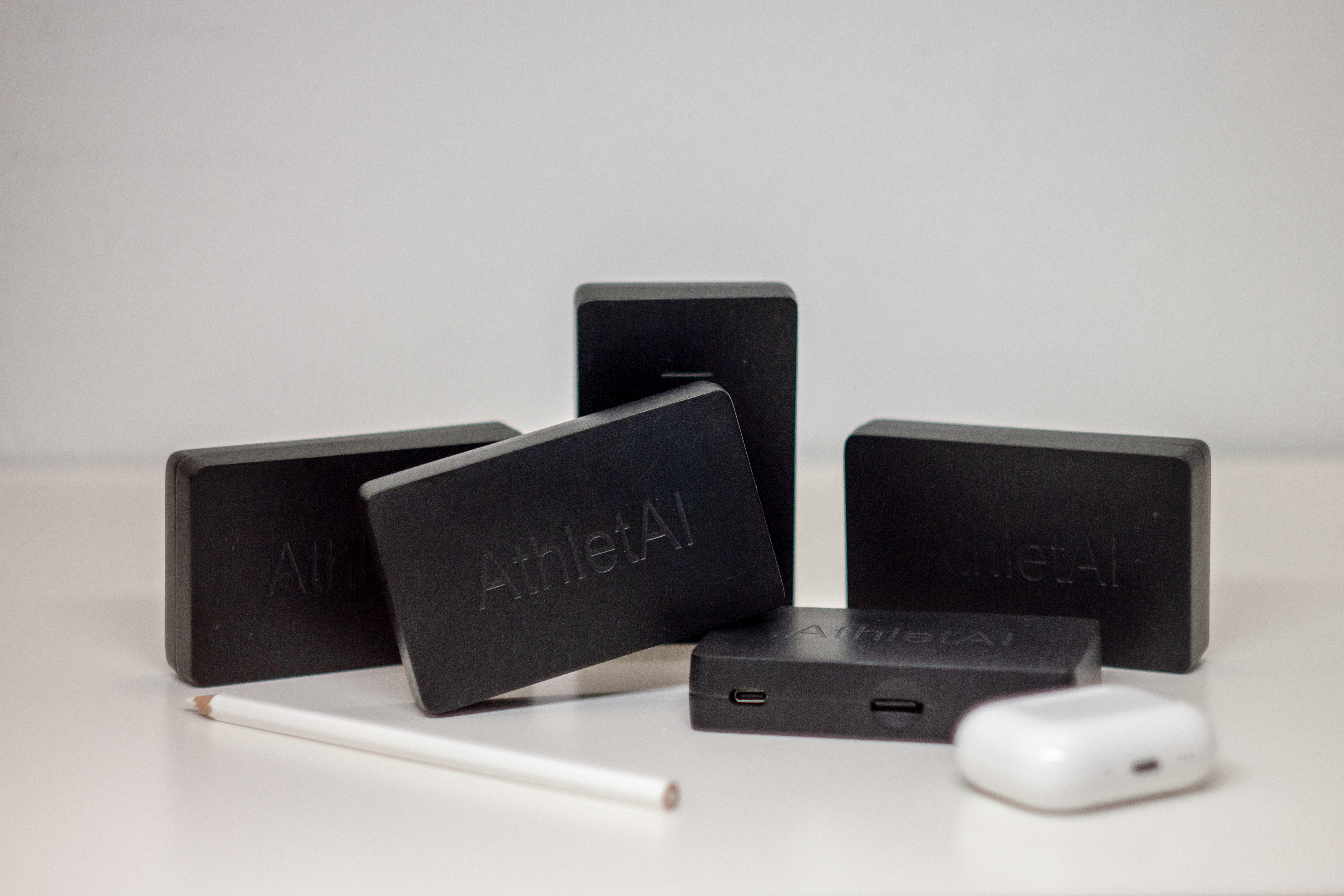 AthletAI sensor devices photographed in studio conditions